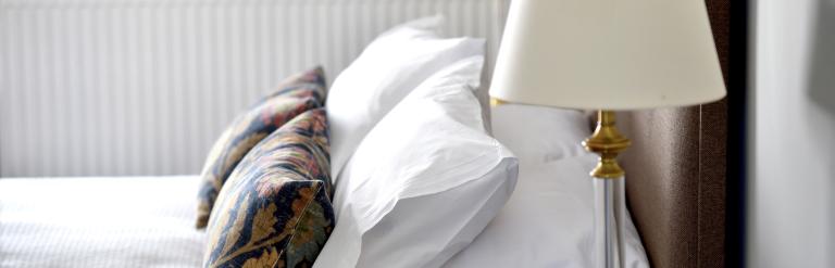 A tidy hotel bed.